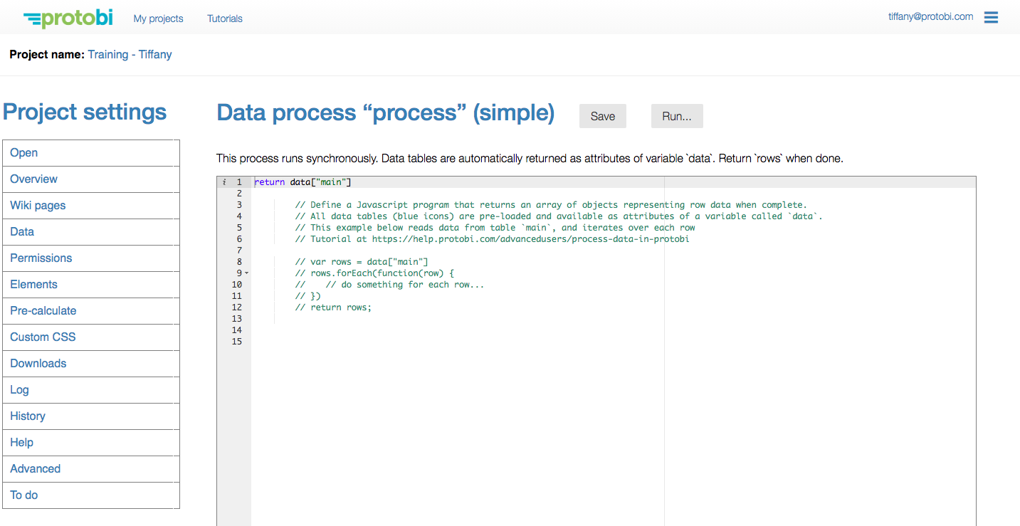 Protobi Data process editor for "process" (simple) showing JavaScript code. The code editor displays "return data['main']" on line 1, followed by comments explaining the process structure including "var rows = data['main']" and "rows.forEach(function(row)" with tutorial link to https://help.protobi.com/advancedusers/process-data-in-protobi. Save and Run buttons appear in the top right.